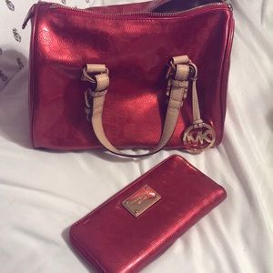 Red Michael Kors purse and wallet